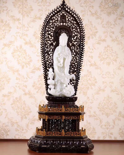 A HETIAN JADE CARVED GUANYIN FIGURE