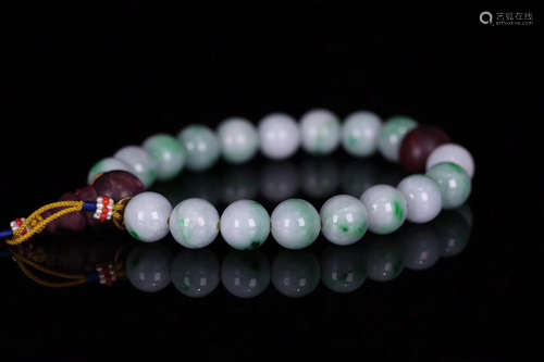 A 18 OLD JADEITE BEADS STRING BRACELET