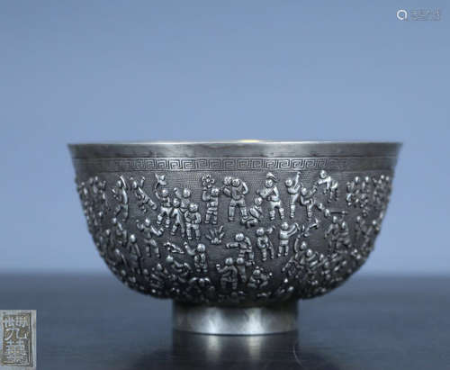 A SILVER MOLDED BOYS PATTERN BOWL