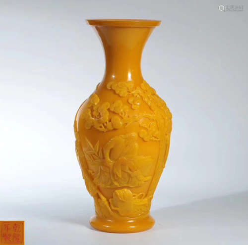 A YELLOW GLASS VASE