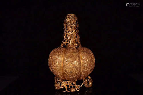 A GILT BRONZE PUMPKIN SHAPED CANDLE HOLDER