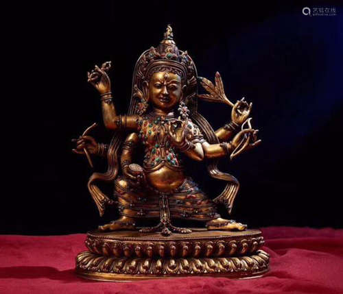 A GILT BRONZE MOLDED TIBETAN BUDDHA STATUE