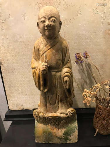 A POTTERY MOLDED LUOHAN BUDDHA