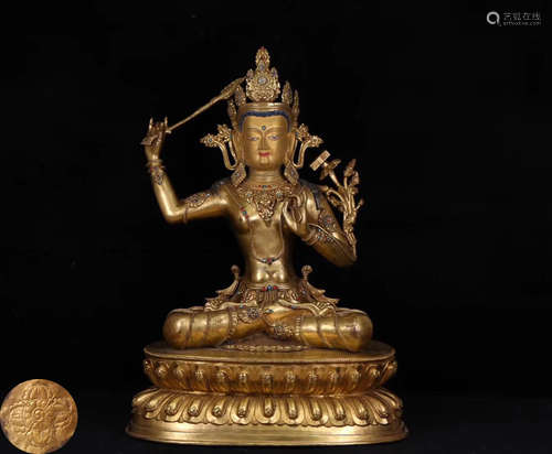 A GILT BRONZE MOLDED WENSHU BUDDHA STATUE