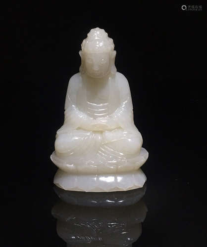 A WHITE JADE CARVED SAKYAMUNI BUDDHA