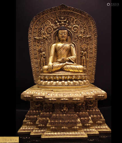 A GILT BRONZE MOLDED SHAKYAMUNI STATUE