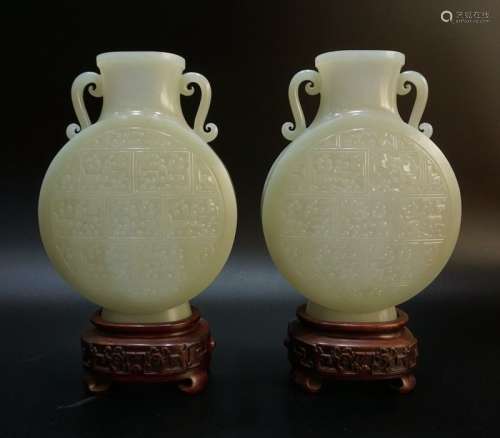 A Magnificent Pair of Carved White Jade Moonflasks