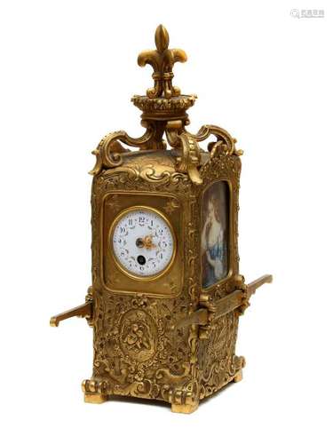 A GILT BRONZE CARRIAGE CLOCK WITH MINIATURES