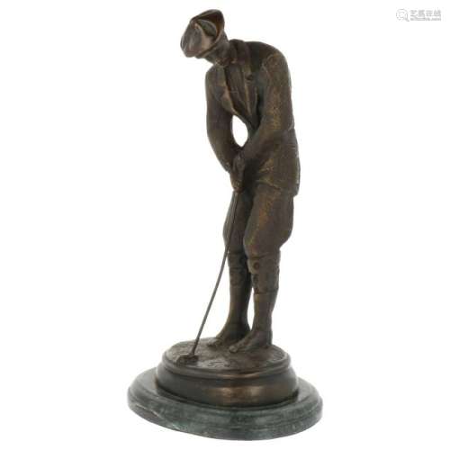 Bronze golfer statue.
