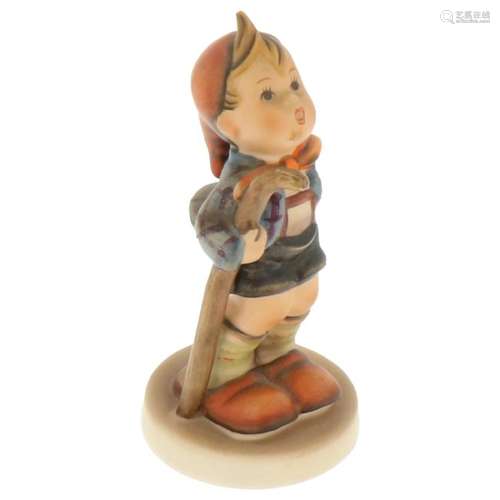 Hummel figurine with walking stick.