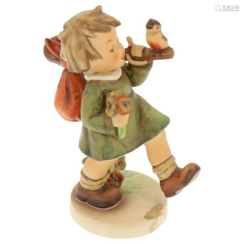 Hummel figurine with knapsack and bird.