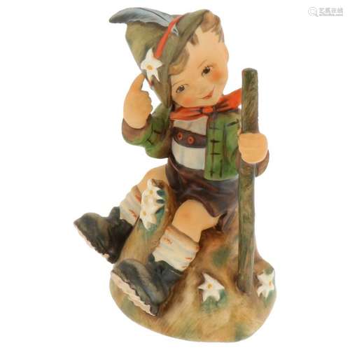 Hummel figurine seated boy with gun.