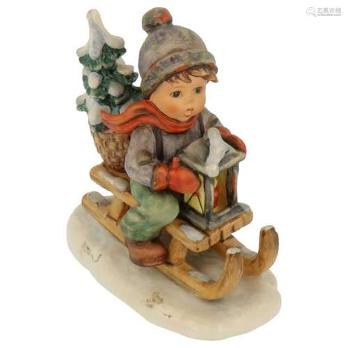 Hummel figurine on a sled.