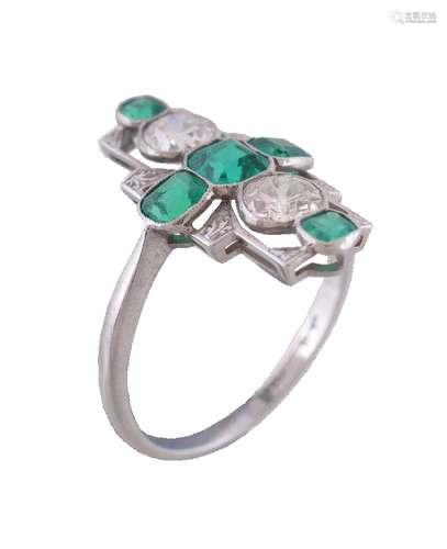 A mid 20th century diamond and emerald panel ring