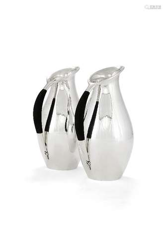 ϒ Georg Jensen, a pair of Danish silver water jugs or pitchers