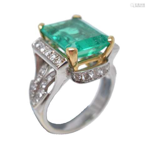 An emerald and diamond dress ring