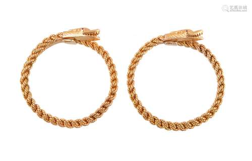 A pair of 1960s gold coloured serpent bangles