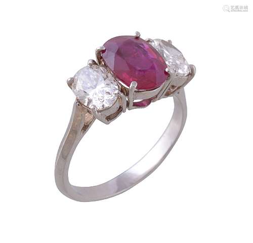 A diamond and ruby three stone ring