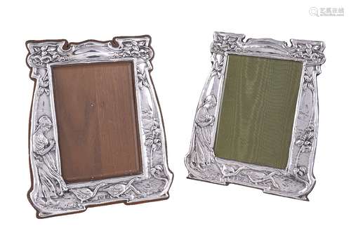 A matched pair of Arts and Crafts silver photograph frames