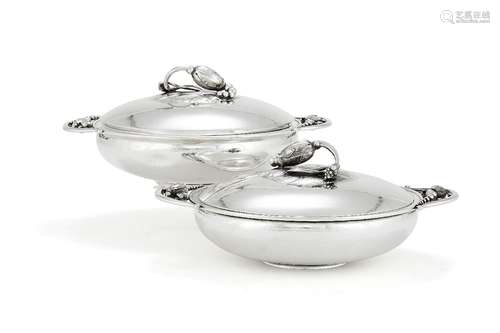 Georg Jensen, a pair of Danish silver Blossom pattern circular vegetable dishes