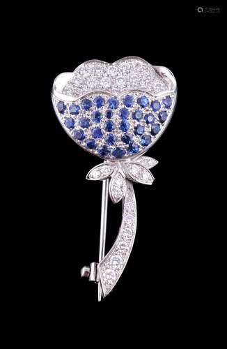 A sapphire and diamond flower brooch