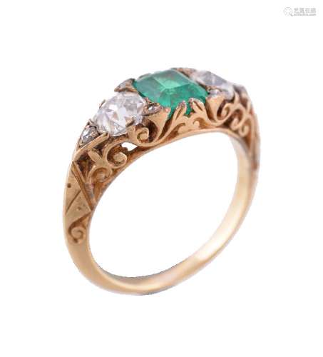 A late 19th century emerald and diamond three stone ring