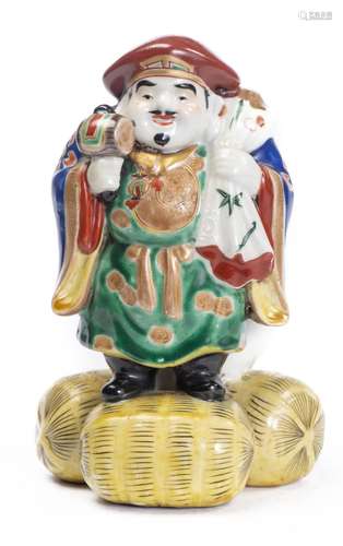 Daikoku 大黒天 en porcelaine de Kutani. Japon XIXe H. 20x13 cm. - - Arts [...]