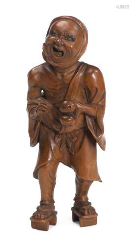 Okimono d'un homme grimaçant en buis sculpté, Japon. H. 17x6.5x6 cm - - Arts [...]