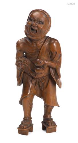 Okimono d'un homme grimaçant en buis sculpté, Japon. H. 17x6.5x6 cm - - Arts [...]