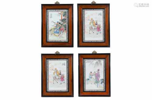Lot of four polychrome porcelain plaques in wooden frames, depicting figures and a poem. Made in
