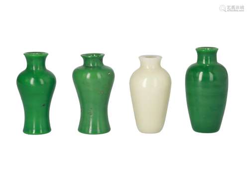 Lot of four peking glass vases, three apple green and one celadon glazed. All unmarked. China,