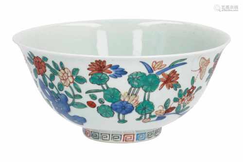 A Wucai porcelain bowl, decorated with flowers and butterflies. Marked with 4-character mark Kangxi.