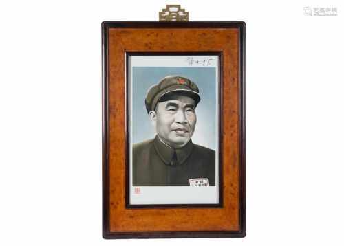A polychrome porcelain plaque in wooden frame, depicting Zhu De (1886 - 1976). Made by Zhu Xing