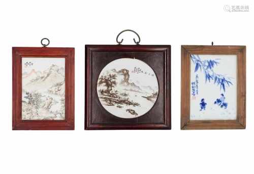 Lot of three polychrome porcelain plaques in wooden frames, decorated with 1) a mountainous river