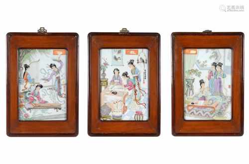 Lot of three polychrome porcelain plaques in wooden frames, depicting 1) ladies making music and
