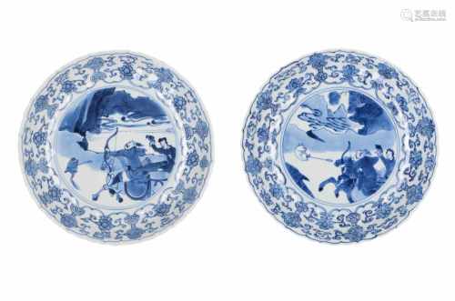 A pair of blue and white porcelain dishes, decorated with a hunting scene. Marked with 6-character