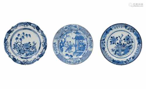 A lot of three blue and white porcelain chargers, decorated with 1) figures on terrace and pagoda.