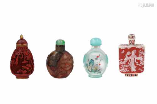 Lot of four snuff bottles, 1) ivory with red and black decor of flowers, a bird and a lady.