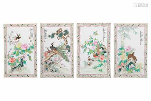 A lot of four polychrome porcelain plaques, decorated with flowers and birds. China, 20th century.