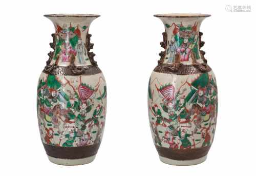A pair of polychrome porcelain vases, decorated with warriors and horsemen. Marked with seal mark