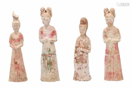 Lot of four white pottery young court ladies, with traces of red and green pigments. China, Tang,