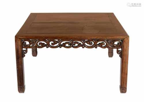A carved wooden table. China, 19th century. Dim. 77 x 75,5 x 44 cm.