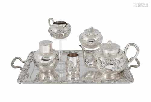 A six-piece silver tea service, incl. teapot, milk jug, tea caddy, sugar jar, spoon vase and serving