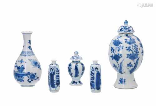 Two diverse blue and white porcelain vases, decorated with symbols and flowers. Both unmarked. Added