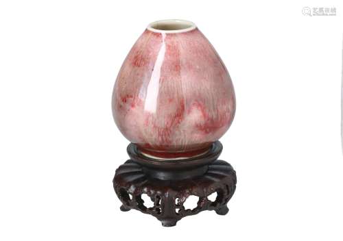 A flambé porcelain miniature vase on wooden base. Marked with 6-character mark. China, 20th century.