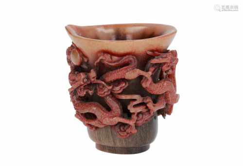 A horn beaker with carved decor of dragons chasing the burning pearl. Marked with seal mark.