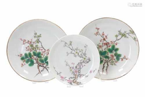 Lot of three polychrome porcelain dishes, decorated with branches. Two unmarked, with seal stamp.