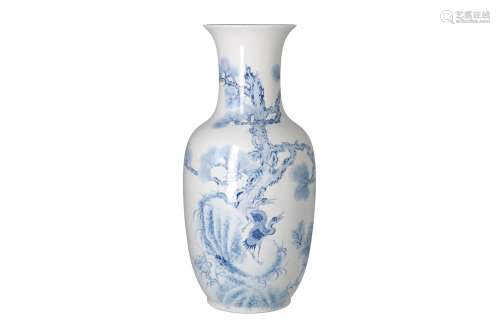 A blue and white porcelain vase, decorated with birds, flowers and a tree. Marked with seal mark