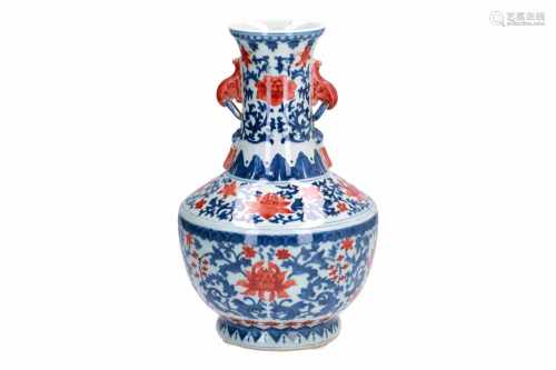 A polychrome porcelain vase, decorated with flowers. Marked with 6-character mark Qianlong. China,