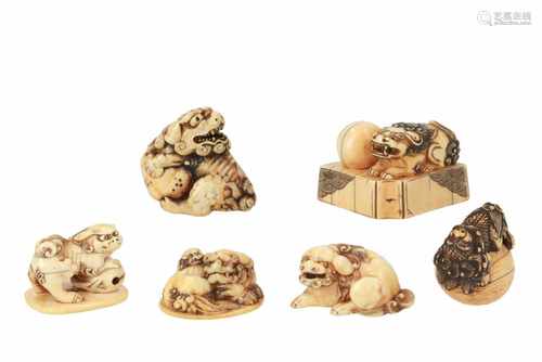 Lot of six netsuke, 1) Ivory reclining shishi with cub on base. L. 3,5 cm. 2) Ivory shishi with ball